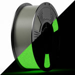 PLA luminous filament spool with green glow ribbon on dark reel